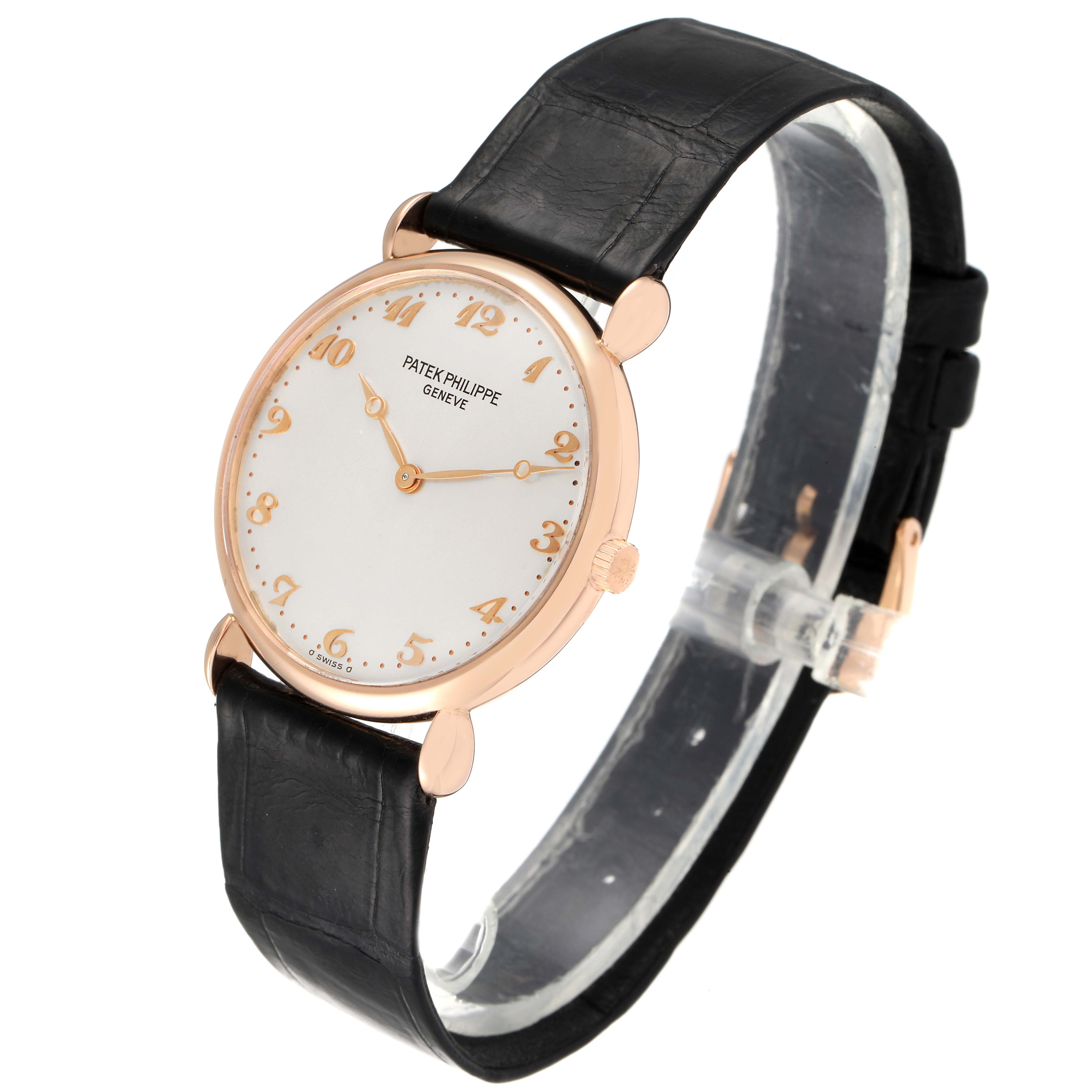 This image shows a side profile of the Patek Philippe Calatrava 3820 Men's Rose Gold Silver Dial 3820 Men's Rose Gold Silver Dial watch, highlighting its face, straps, and crown.