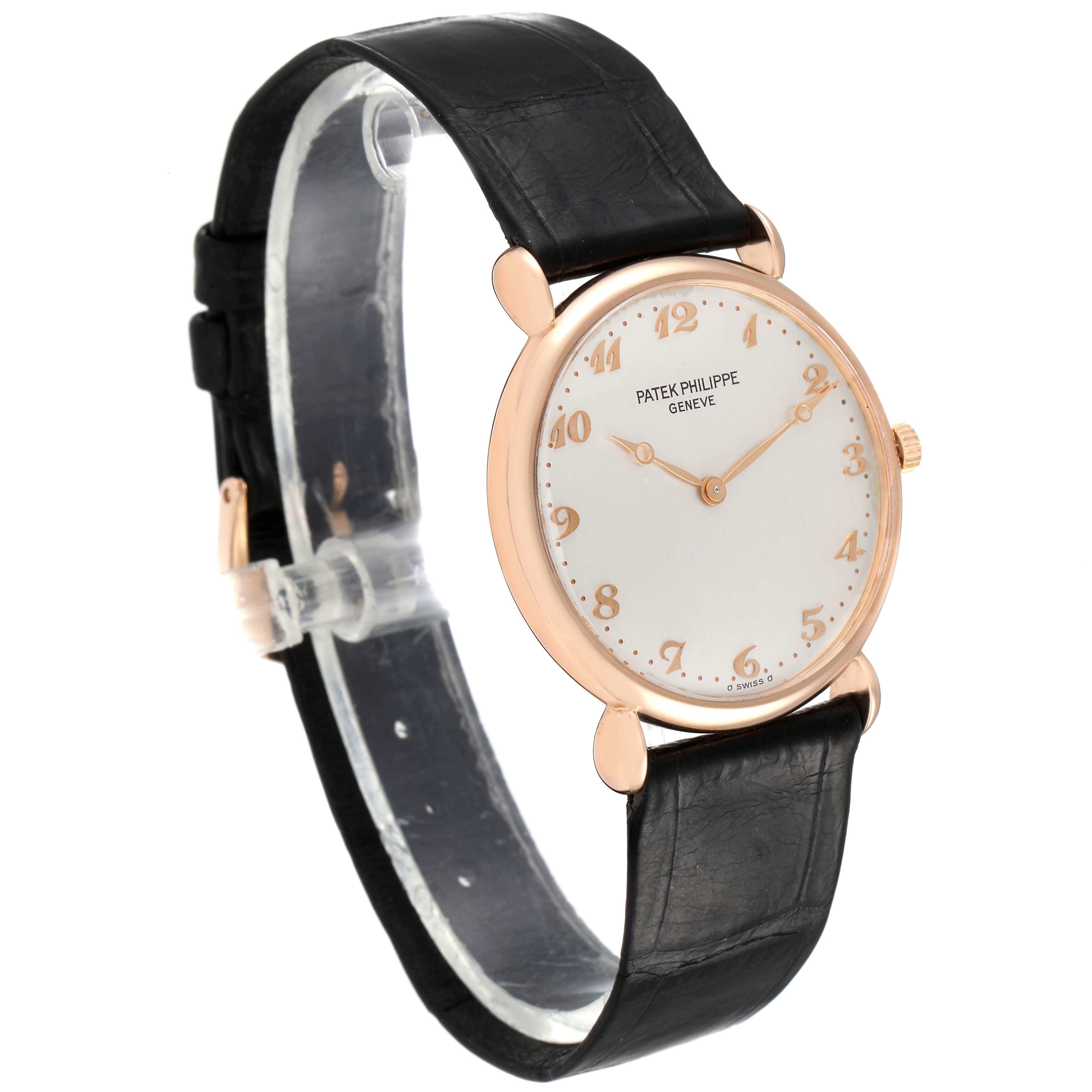 The image shows a side-angle view of the Patek Philippe Calatrava 3820 Men's Rose Gold Silver Dial 3820 Men's Rose Gold Silver Dial watch displaying its face, case, and leather strap.