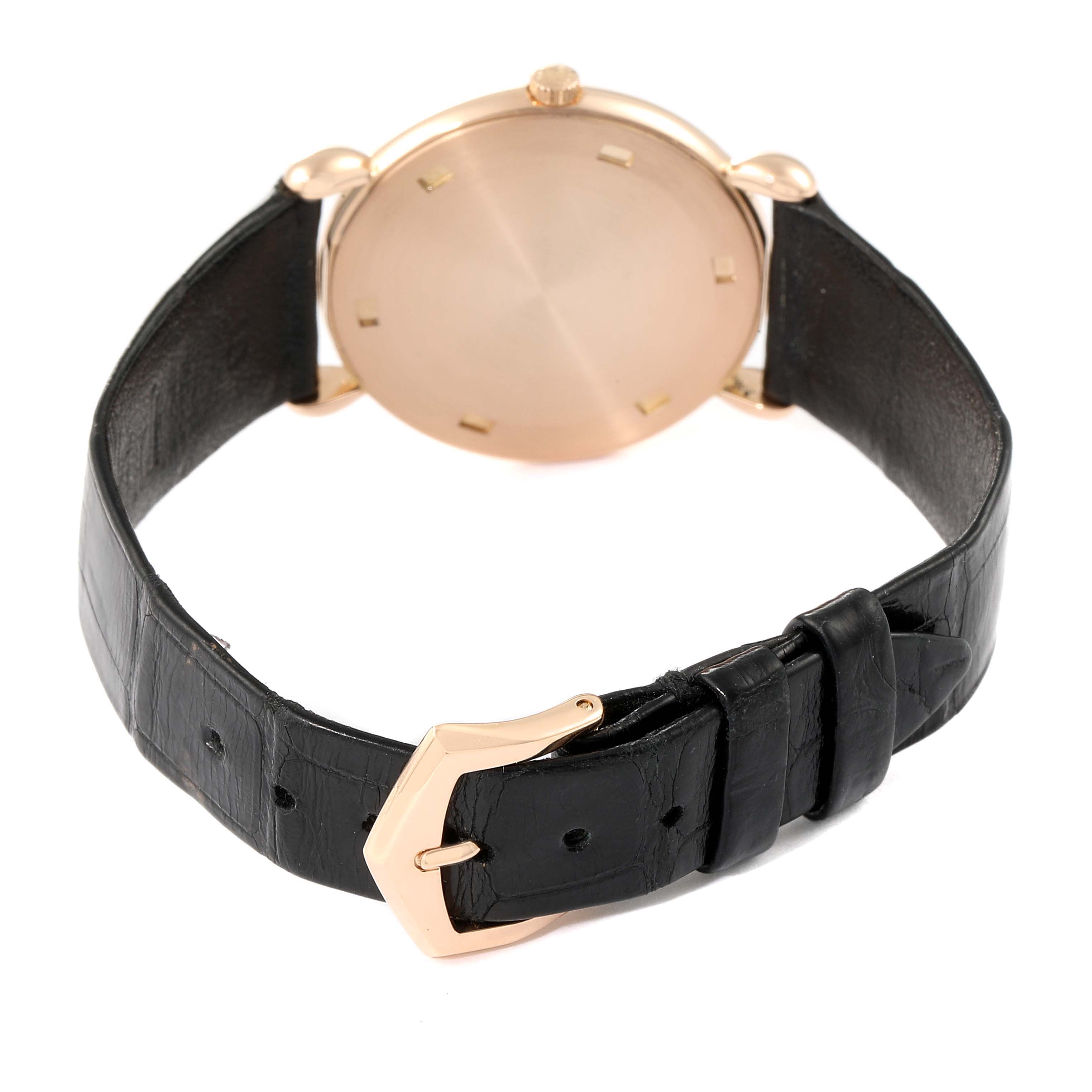 This image shows the back view of a Calatrava model by Patek Philippe, highlighting its leather strap and gold buckle.