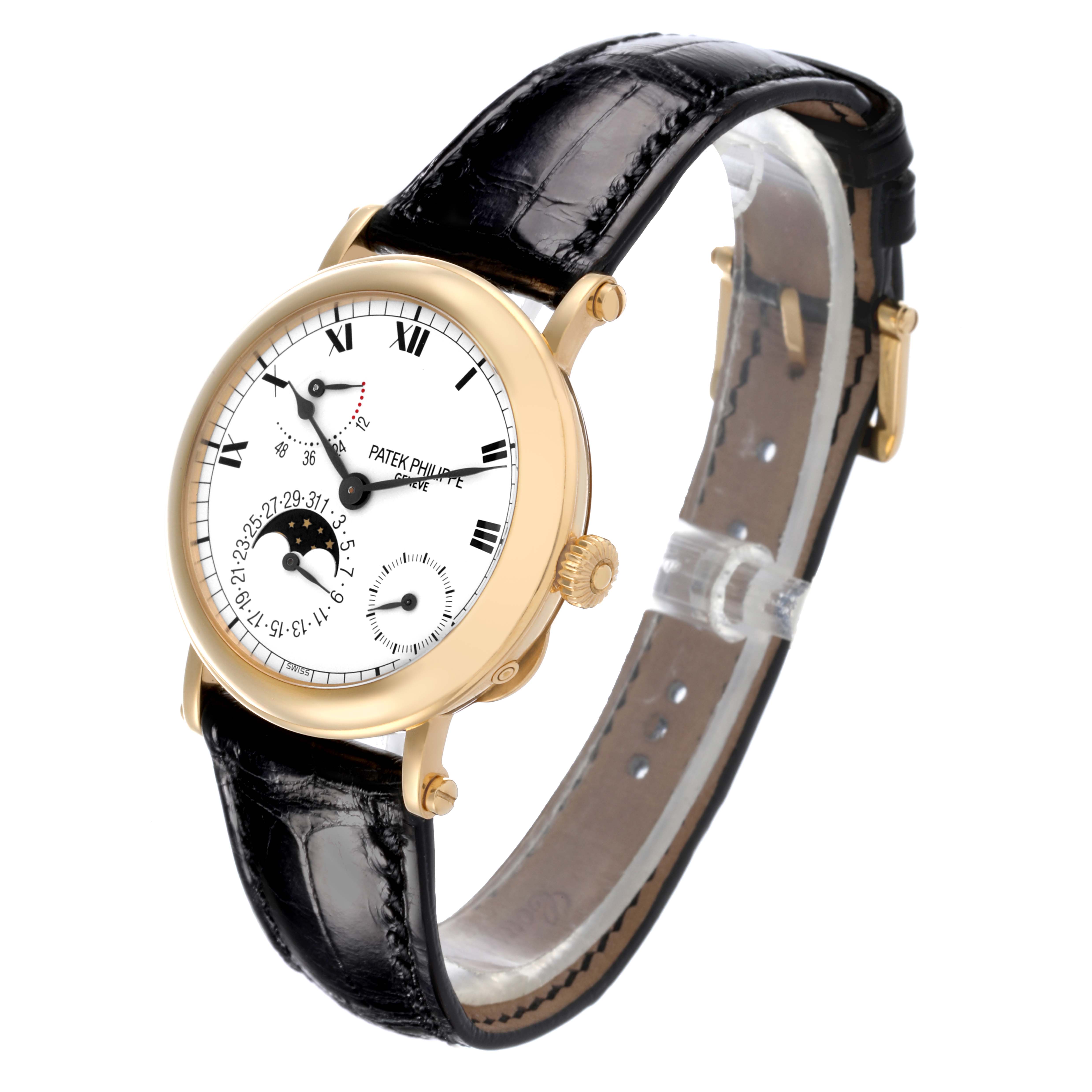 The Patek Philippe Complications 5054 Men's Yellow Gold White Dial 5054 Men's Yellow Gold White Dial watch is shown at an angle highlighting the face, case, crown, and black leather strap.