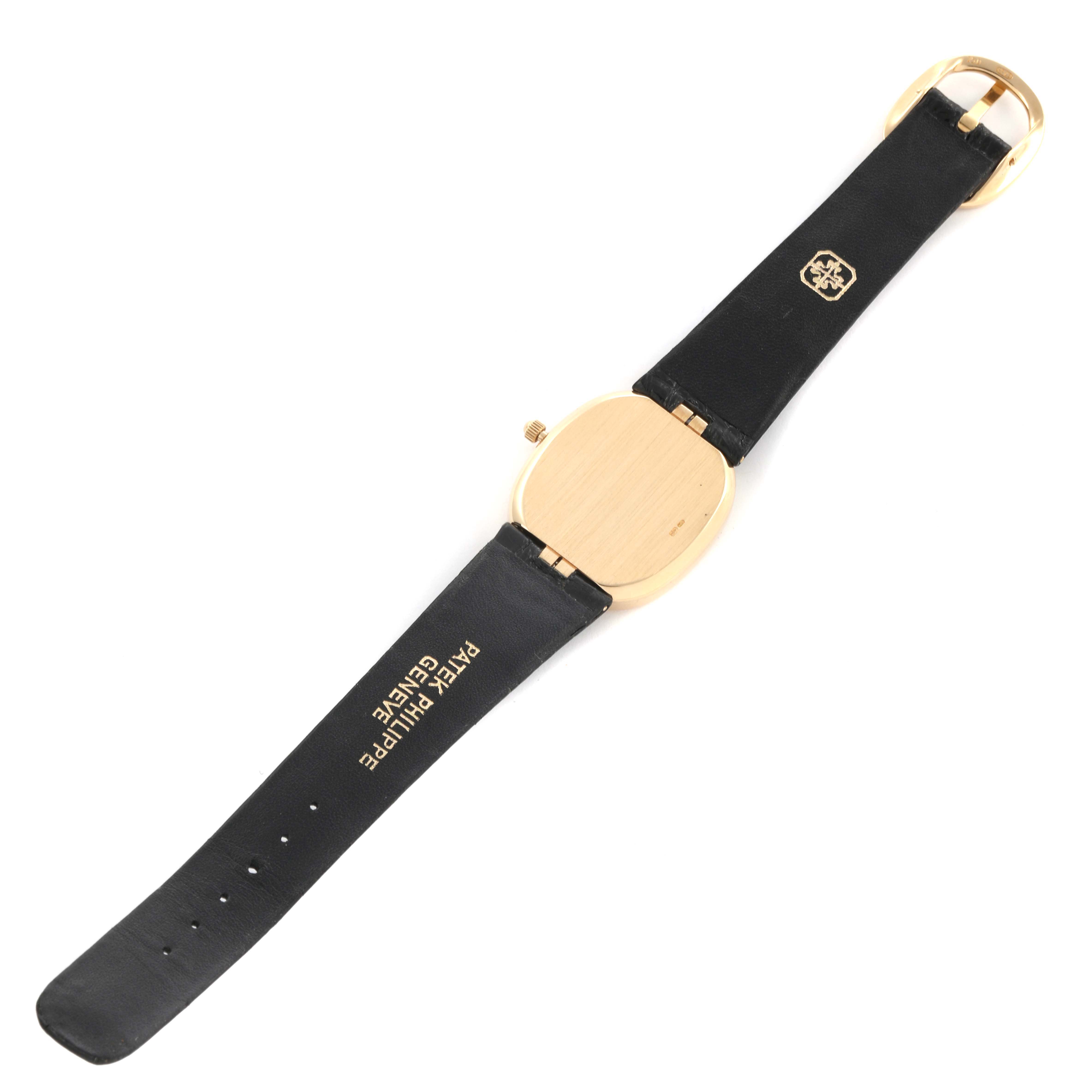 The Patek Philippe Golden Ellipse 3788J Men's Yellow Gold Blue Dial 3788J Men's Yellow Gold Blue Dial watch is shown from the back, highlighting the strap and clasp.