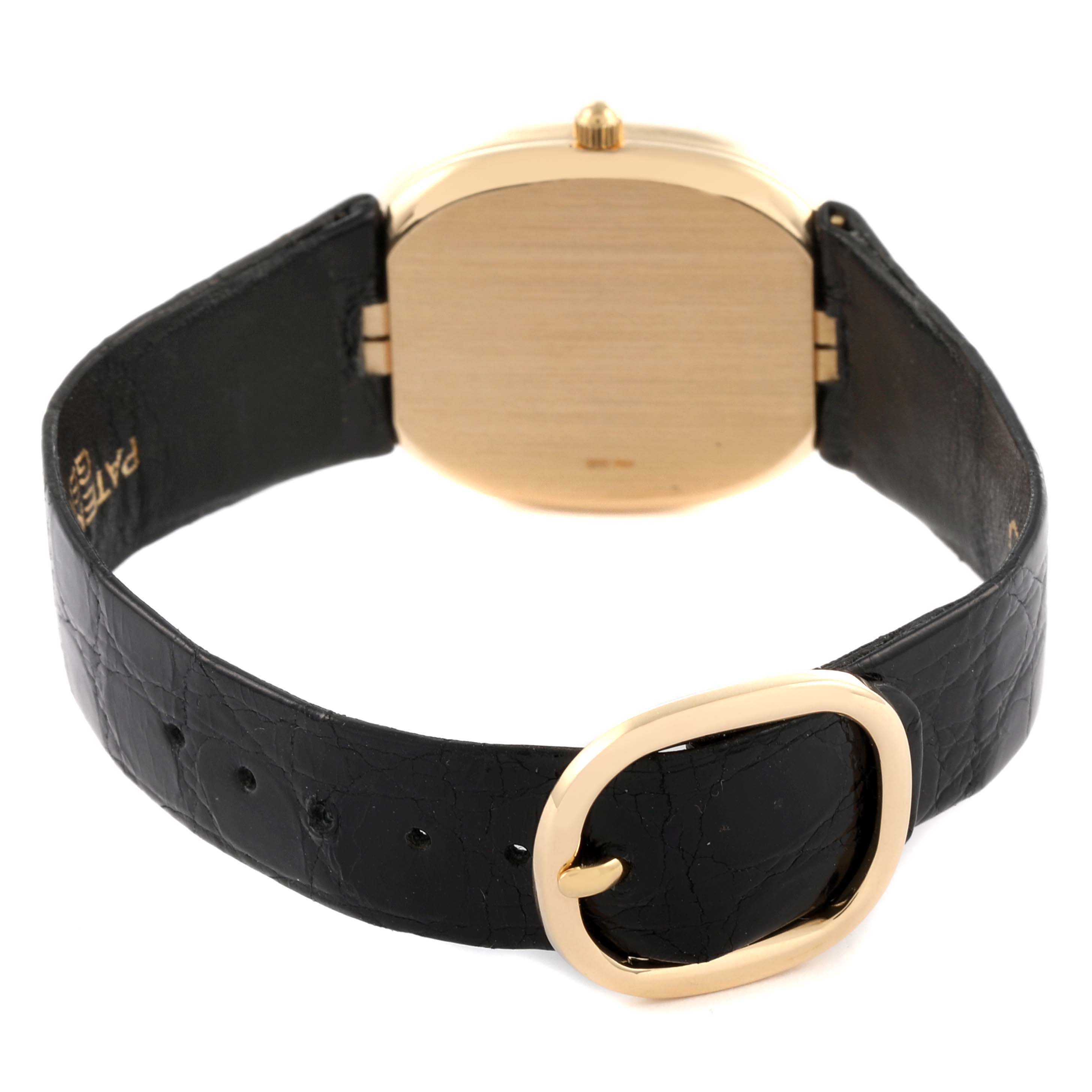 The image shows the back and side of a Patek Philippe Golden Ellipse 3788J Men's Yellow Gold Blue Dial 3788J Men's Yellow Gold Blue Dial watch, highlighting its strap and clasp.