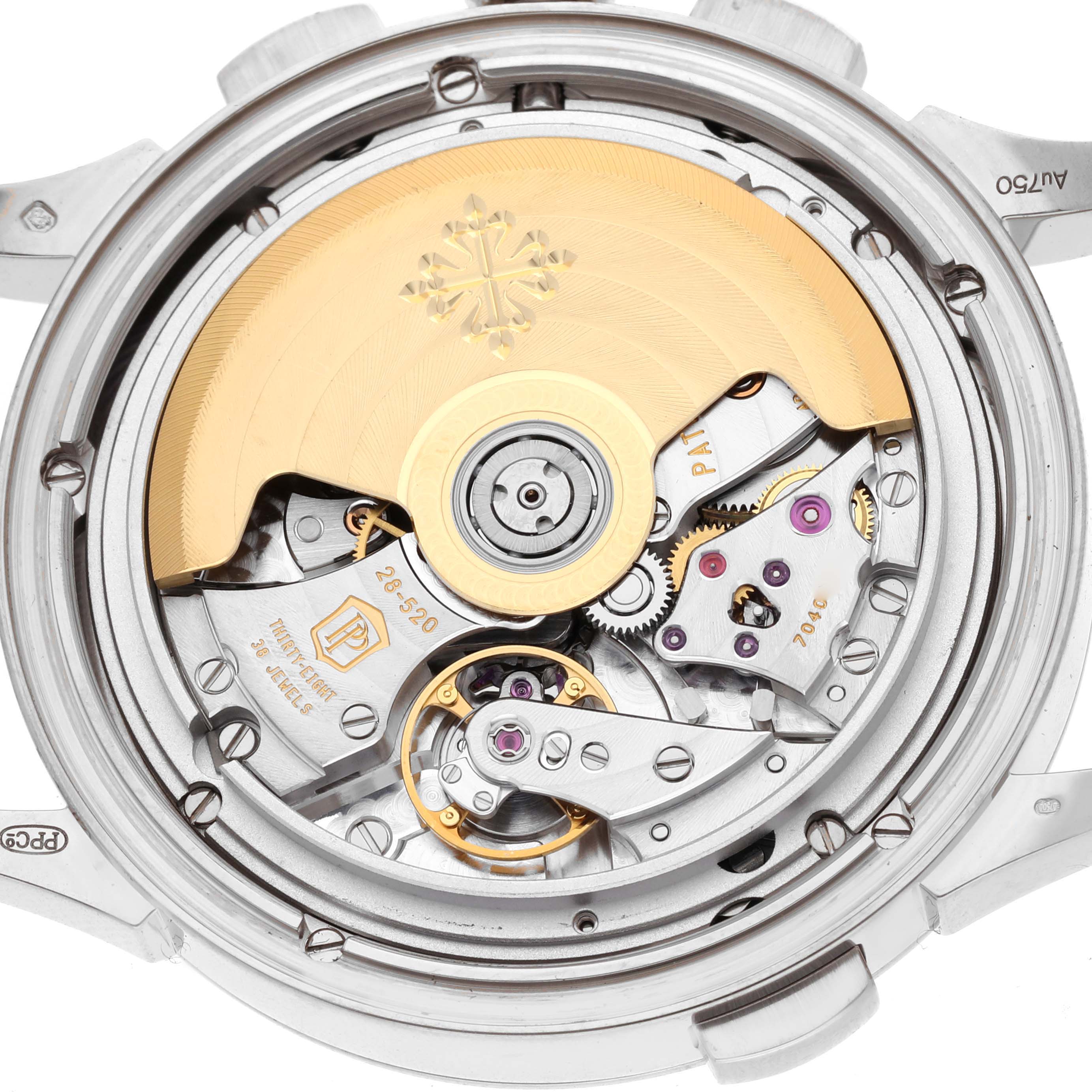 The image shows the back view of a Patek Philippe Complications 5930G-001 Men's White Gold Blue Dial 5930G-001 Men's White Gold Blue Dial watch, highlighting the intricate movement and rotor.