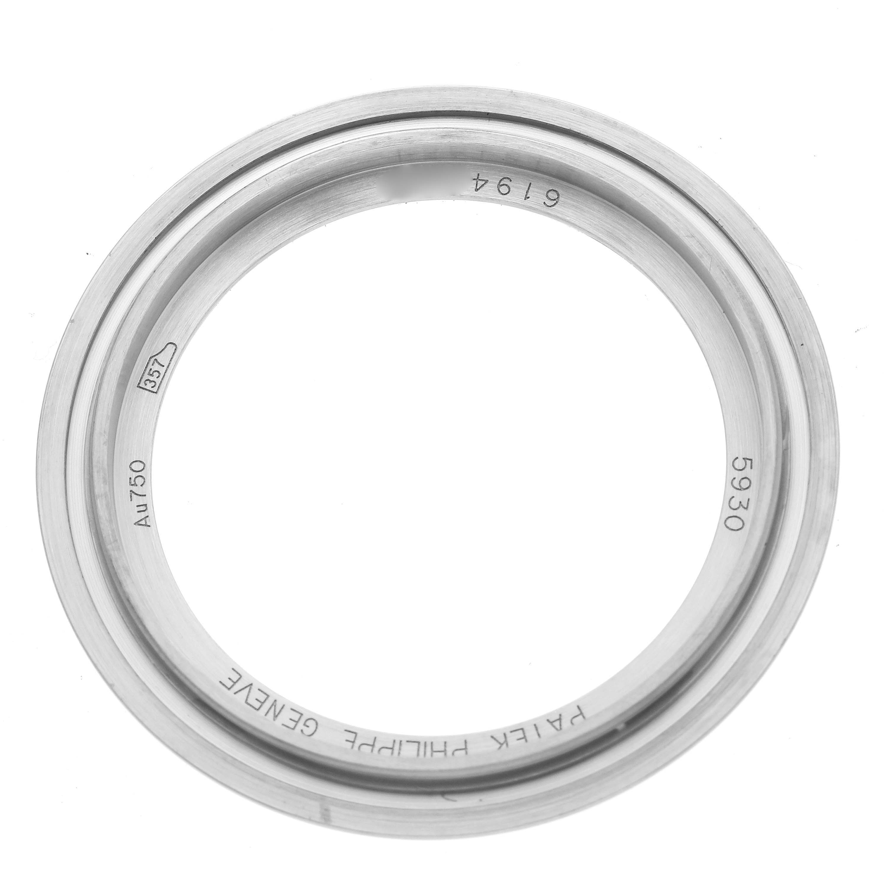 The image shows a bezel from the Patek Philippe Complications 5930G-001 Men's White Gold Blue Dial 5930G-001 Men's White Gold Blue Dial model 5930, photographed from a top-down angle.