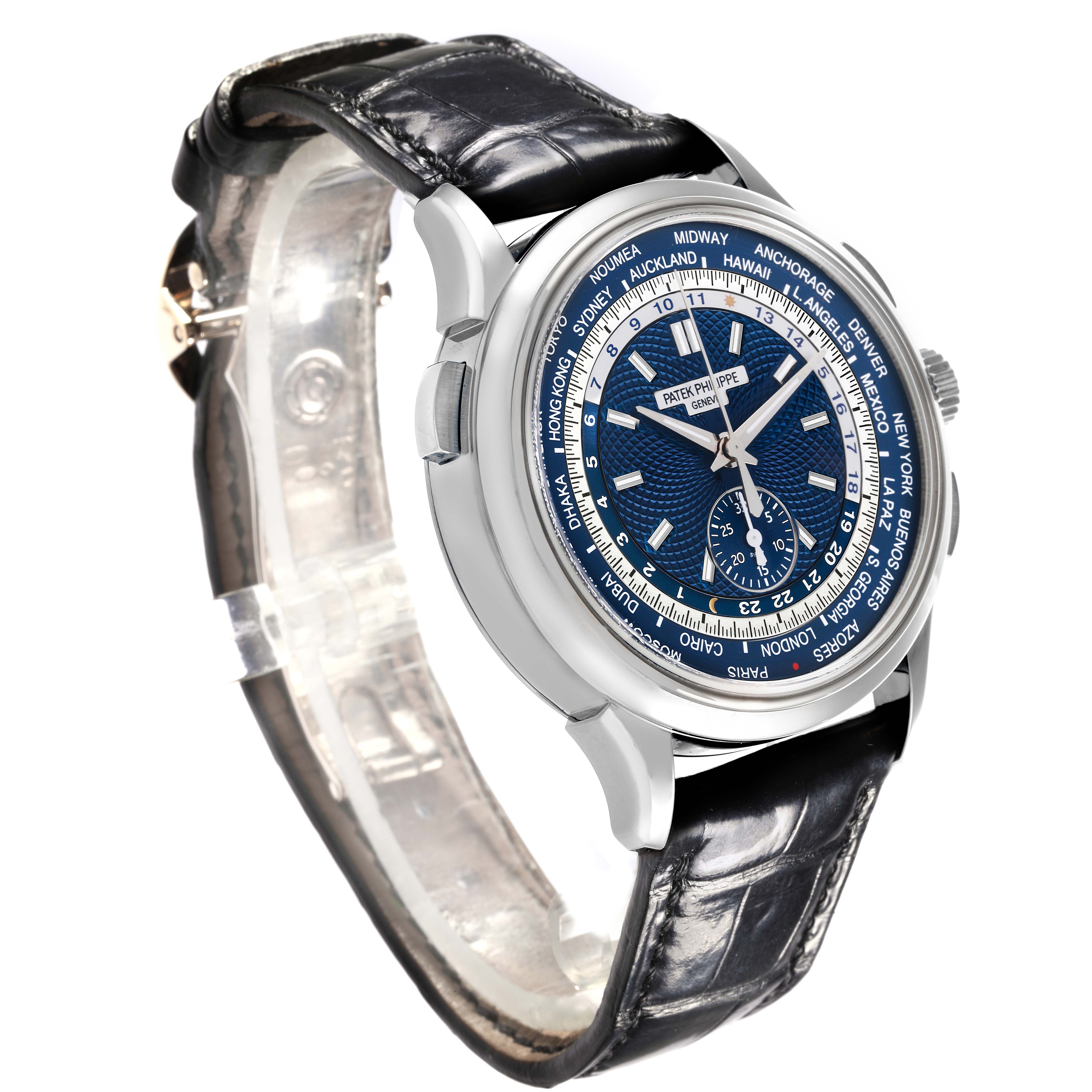 The watch is a Patek Philippe Complications 5930G-001 Men's White Gold Blue Dial 5930G-001 Men's White Gold Blue Dial model shown from a side angle displaying the dial, case, and part of the strap.