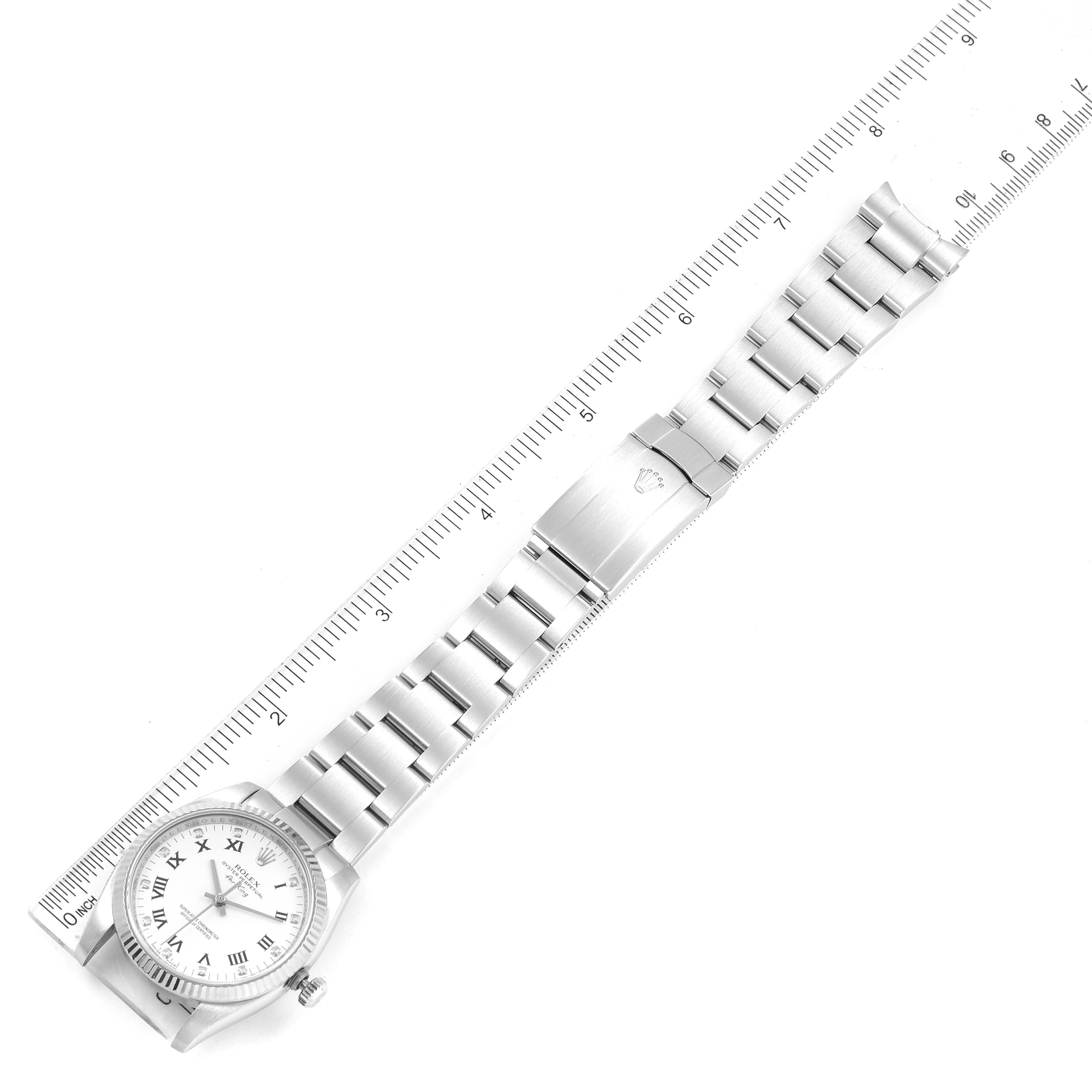 The image shows a top-down view of a Rolex Air-King 114234 Men's Stainless Steel White Dial 114234 Men's Stainless Steel White Dial watch, highlighting its full band alongside a ruler for scale.