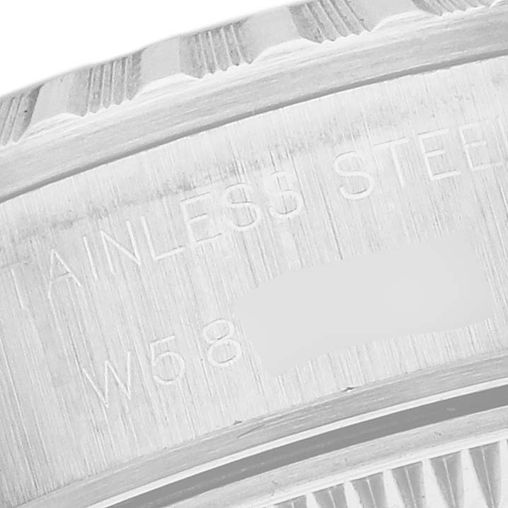 The image shows an angled close-up of the stainless steel casing with engraved text from the Rolex Date 69240 Women's Stainless Steel Black Dial 69240 Women's Stainless Steel Black Dial model.