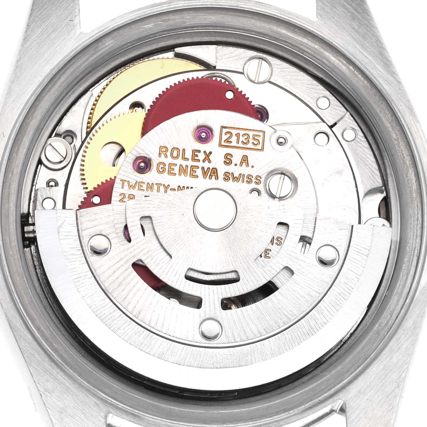 The image shows the movement of a Rolex Date 69240 Women's Stainless Steel Silver Dial 69240 Women's Stainless Steel Silver Dial model, displaying gears and inscriptions, viewed from the back.
