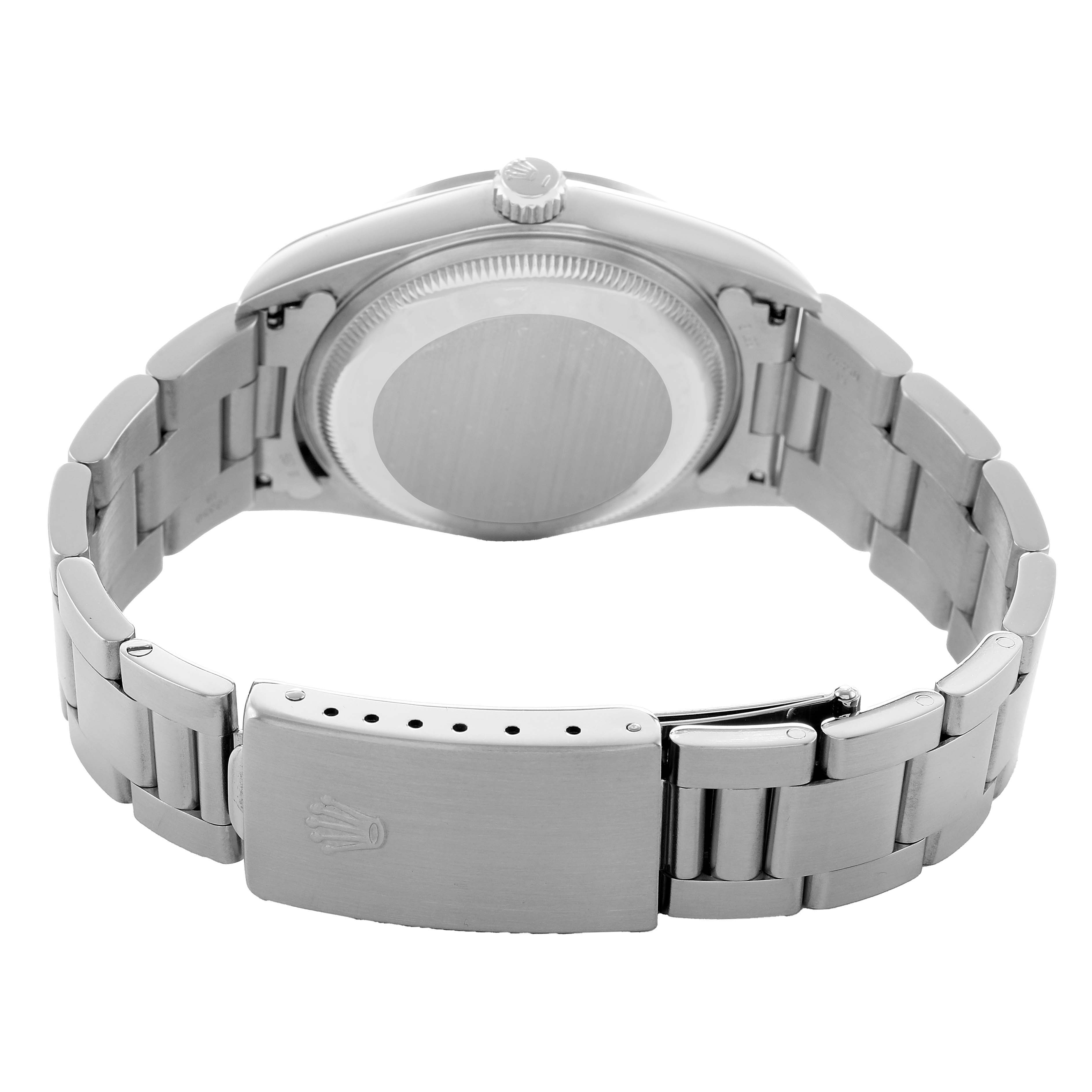 The Rolex Date 15200 Men's Stainless Steel Pink Dial watch is shown from the back, highlighting the case back, bracelet, and clasp.