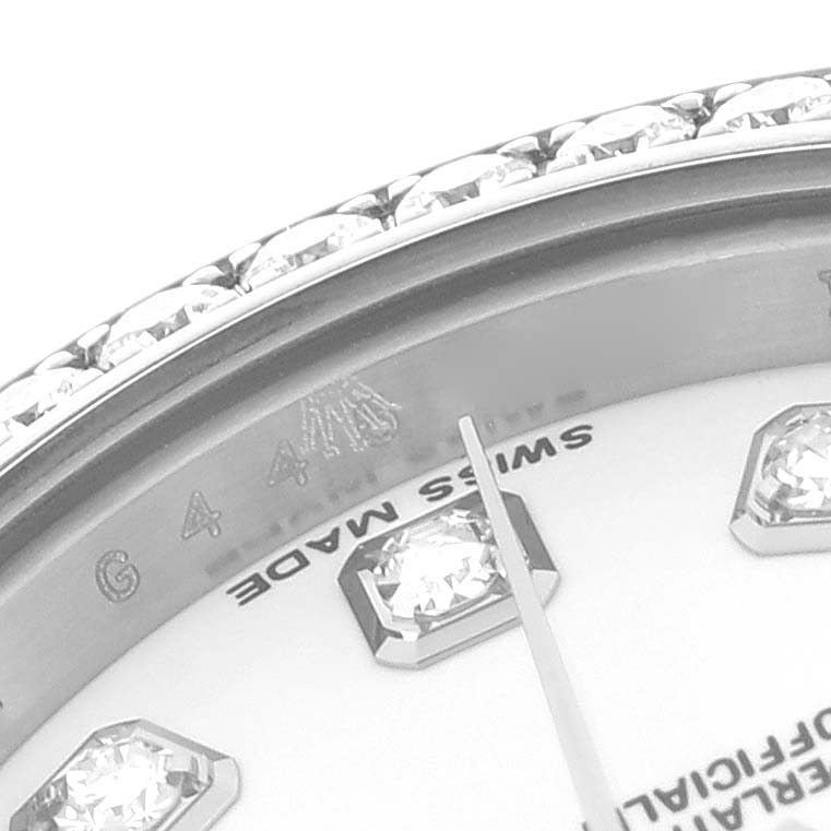The image shows a close-up of the bezel and part of the dial with diamond markers on a Rolex Datejust 179384 Women's Stainless Steel White Dial 179384 Women's Stainless Steel White Dial watch.