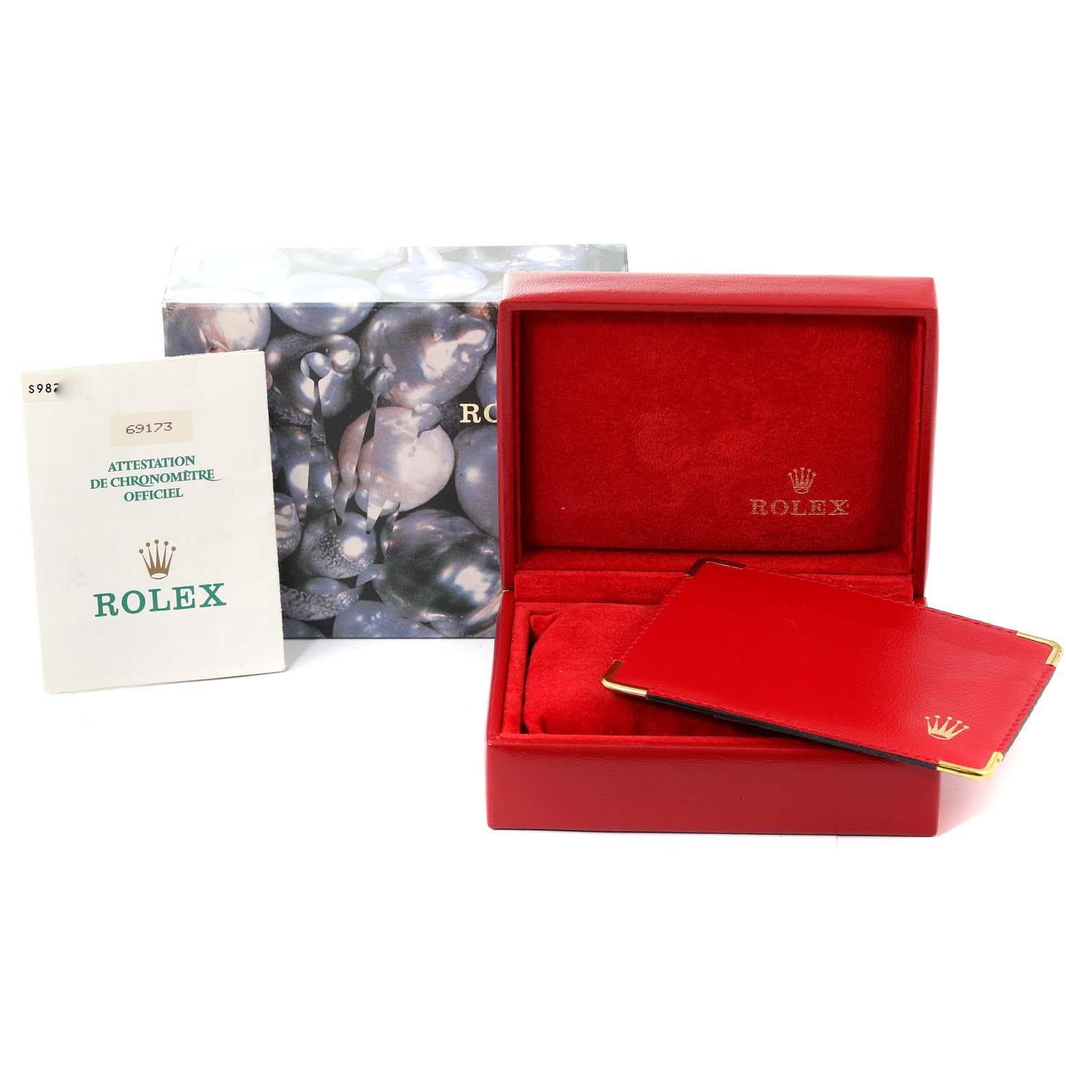 The image shows the accessories for a Rolex Datejust 69173 Women's Steel and Gold (two tone) Champagne Dial 69173 Women's Steel and Gold (two tone) Champagne Dial including the box, certificate, and red booklet, all viewed from the front.