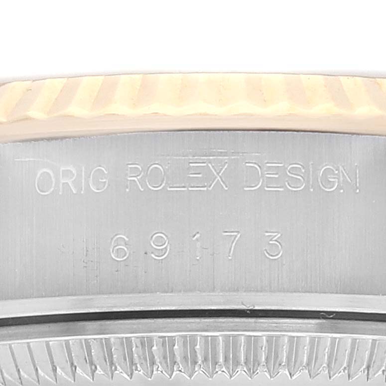 The image shows an engraved side view of the bezel and case of a Rolex Datejust 69173 Women's Steel and Gold (two tone) Champagne Dial 69173 Women's Steel and Gold (two tone) Champagne Dial watch.