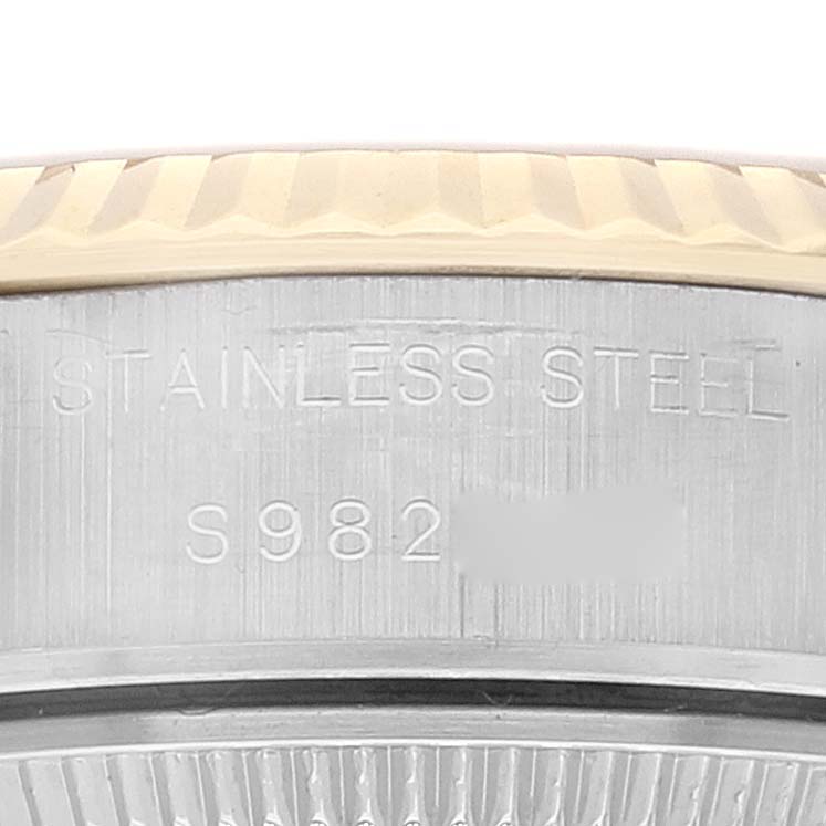 This image shows a close-up of the stainless steel case back of a Rolex Datejust 69173 Women's Steel and Gold (two tone) Champagne Dial 69173 Women's Steel and Gold (two tone) Champagne Dial watch with a partial view of its serial number.