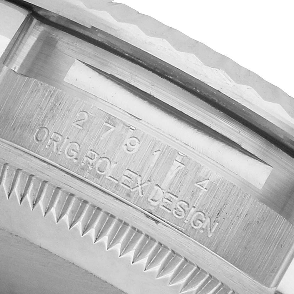 The image shows a close-up of the engraving on the case side of a Rolex Datejust 279174 Women's Stainless Steel Silver Dial watch.