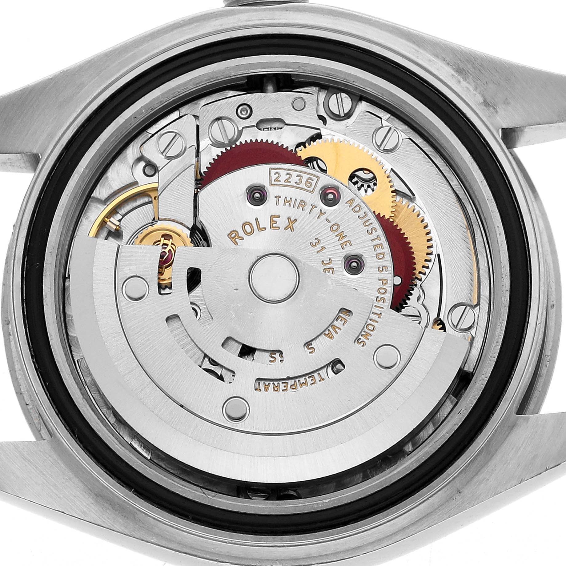 The image shows the movement of a Rolex Datejust 279174 Women's Stainless Steel Silver Dial watch from a back view, highlighting its internal mechanisms and gears.