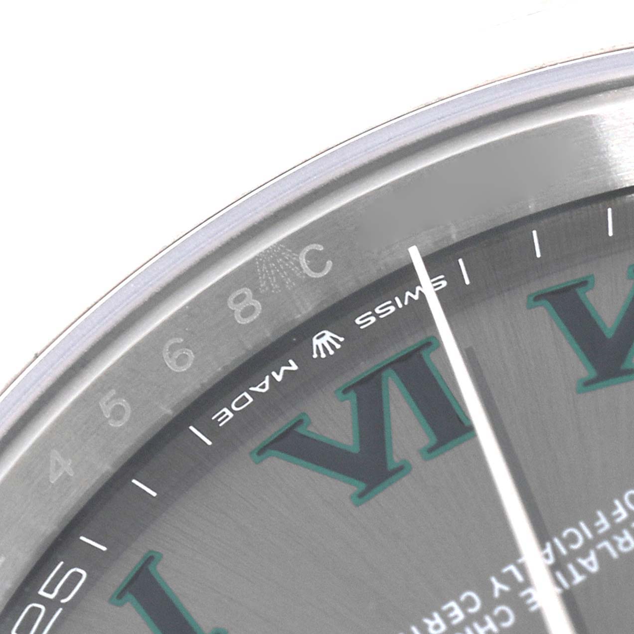 This image shows a close-up of the dial and part of the bezel of a Rolex Datejust 41 126300 Men's Stainless Steel Grey Dial 126300 Men's Stainless Steel Grey Dial watch, highlighting the "Swiss Made" text.