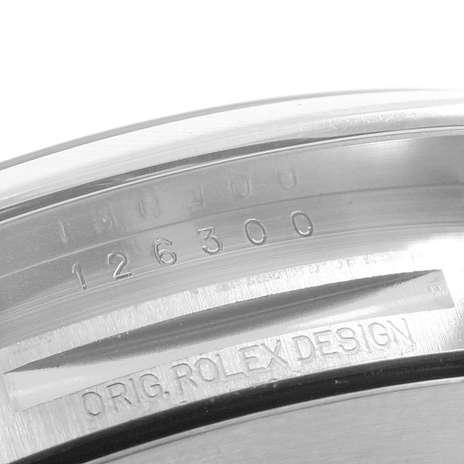 The image shows a close-up angle of the Rolex Datejust 41 126300 Men
s Stainless Steel Silver Dial 126300 Men
s Stainless Steel Silver Dial model
s inner case with the serial and model numbers.