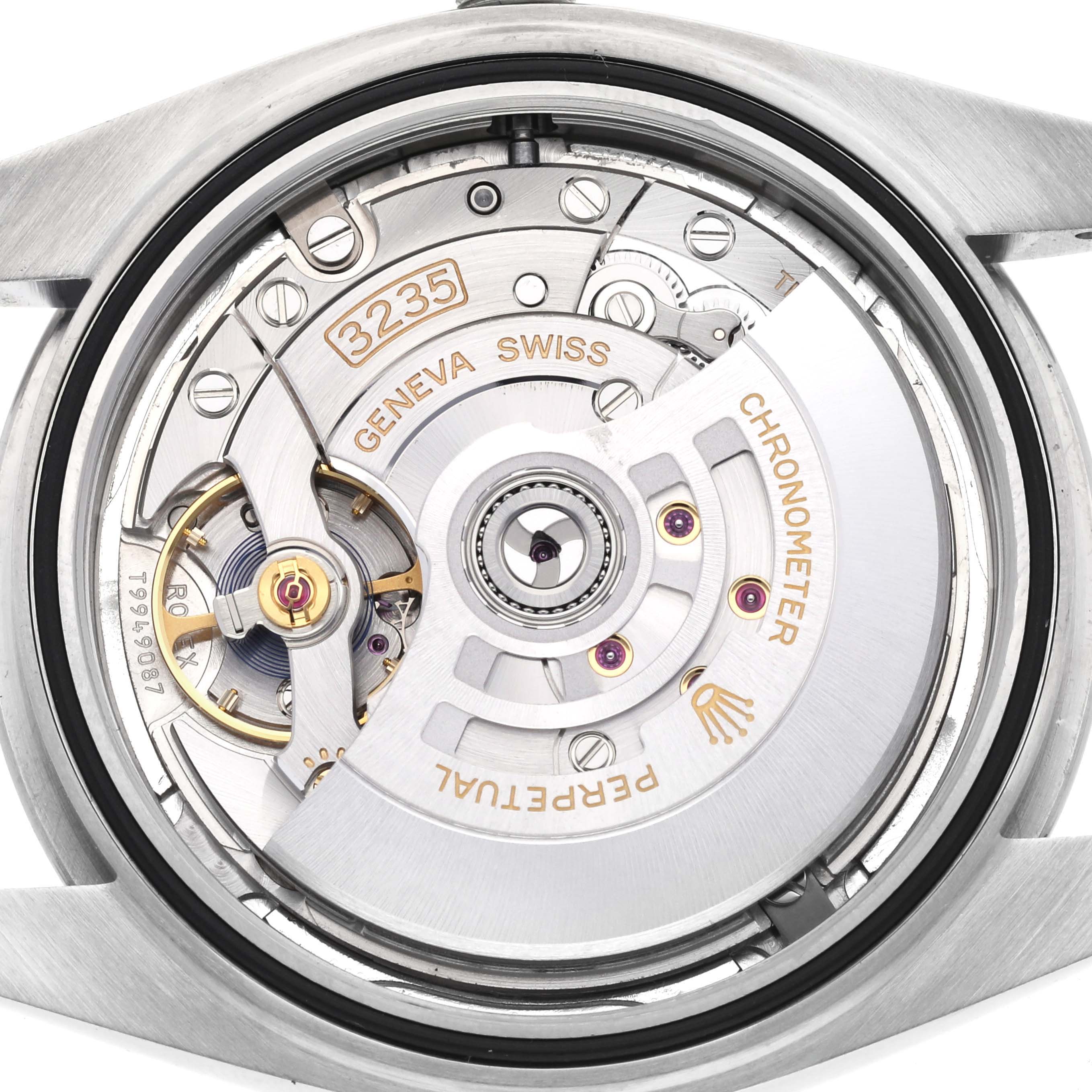 The image shows the back view of a Rolex Datejust 126300 Men
s Stainless Steel Silver Dial 126300 Men
s Stainless Steel Silver Dial, showcasing its movement and internal mechanism.