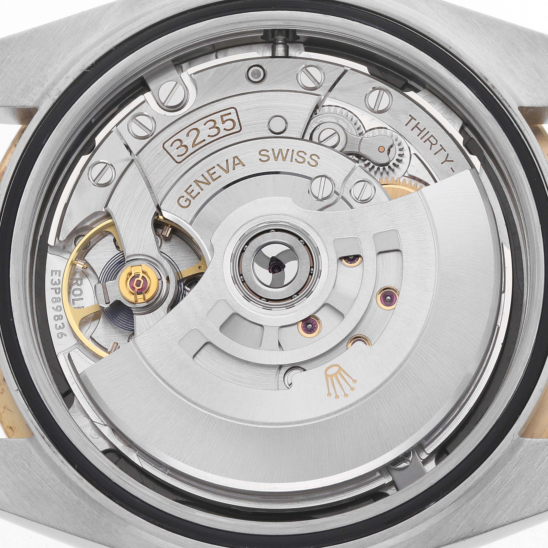 This image shows the movement of a Rolex Datejust 41 126333 Men's Steel and Gold (two tone) Black Dial from a back angle, highlighting the intricate mechanics and rotor.