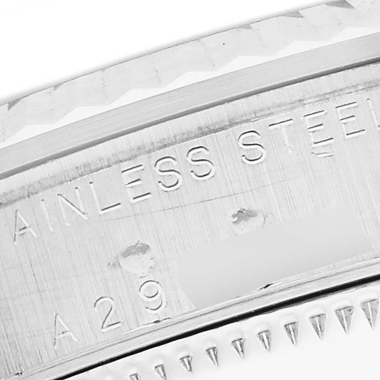 This image shows a close-up of the case back marking on a Rolex Mid-Size 78274 Women's Stainless Steel Mother of Pearl Dial watch, highlighting the "STAINLESS STEEL" engraving.
