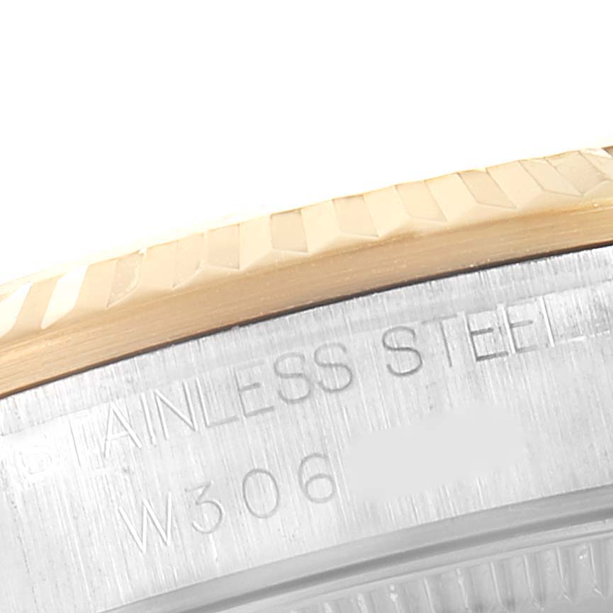 The image shows a close-up of the stainless steel case and gold bezel of a Mid-Size Rolex watch.