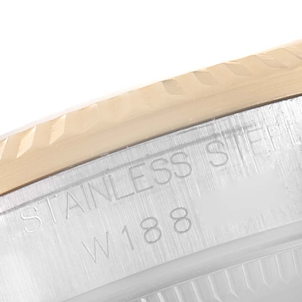 The image shows a close-up of the case back edge of a Rolex Mid-Size 68273 Women
s Steel and Gold (two tone) Black Dial 68273 Women
s Steel and Gold (two tone) Black Dial watch, highlighting "Stainless Steel" and part of the reference number.