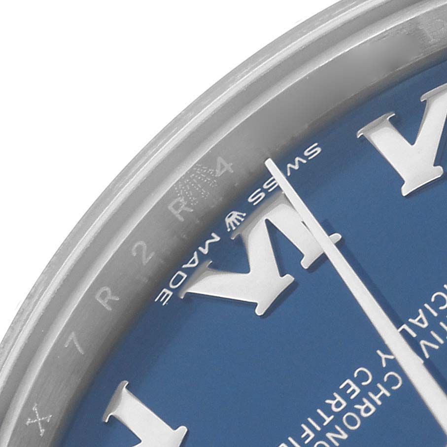 The image shows a close-up of the blue dial and bezel edge of a Rolex Mid-Size 278274 Women's Stainless Steel Blue Dial 278274 Women's Stainless Steel Blue Dial watch, highlighting the "Swiss Made" text.