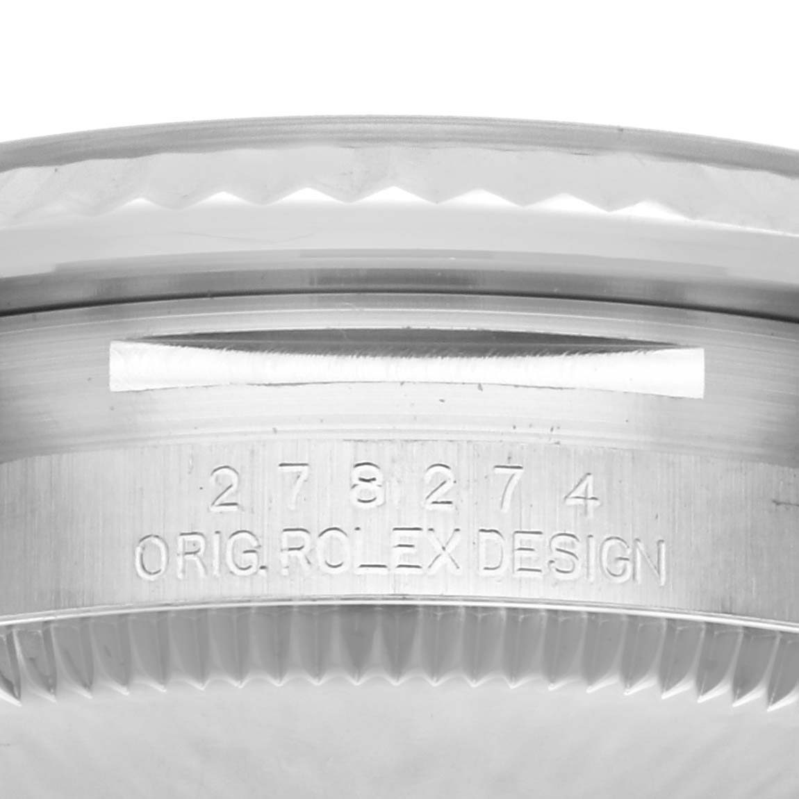 The image shows a close-up of the side of a Rolex Mid-Size 278274 Women's Stainless Steel Blue Dial 278274 Women's Stainless Steel Blue Dial watch, highlighting the serial number and design engraving.