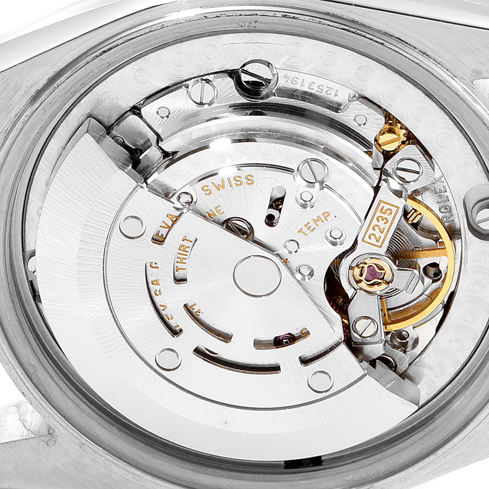 This image shows a close-up view of the movement and internal components of a Mid-Size Rolex watch.