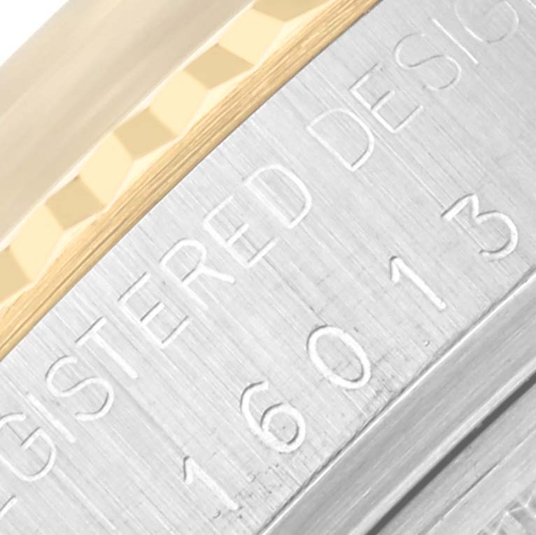 The image shows a close-up of the engraved case and bezel of a Rolex Vintage Collection 16013 Men's Steel and Gold (two tone) Silver Dial 16013 Men's Steel and Gold (two tone) Silver Dial watch, focusing on its textured details.