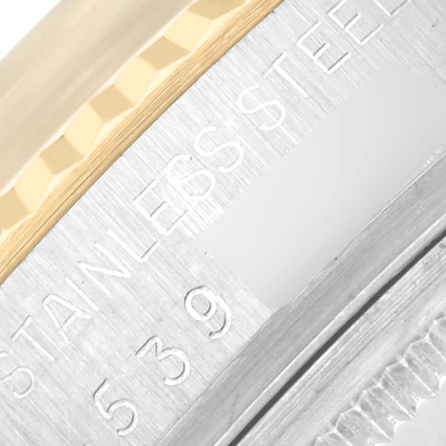 The image shows a close-up of the stainless steel and fluted bezel of the Rolex Vintage Collection 16013 Men's Steel and Gold (two tone) Silver Dial 16013 Men's Steel and Gold (two tone) Silver Dial watch.