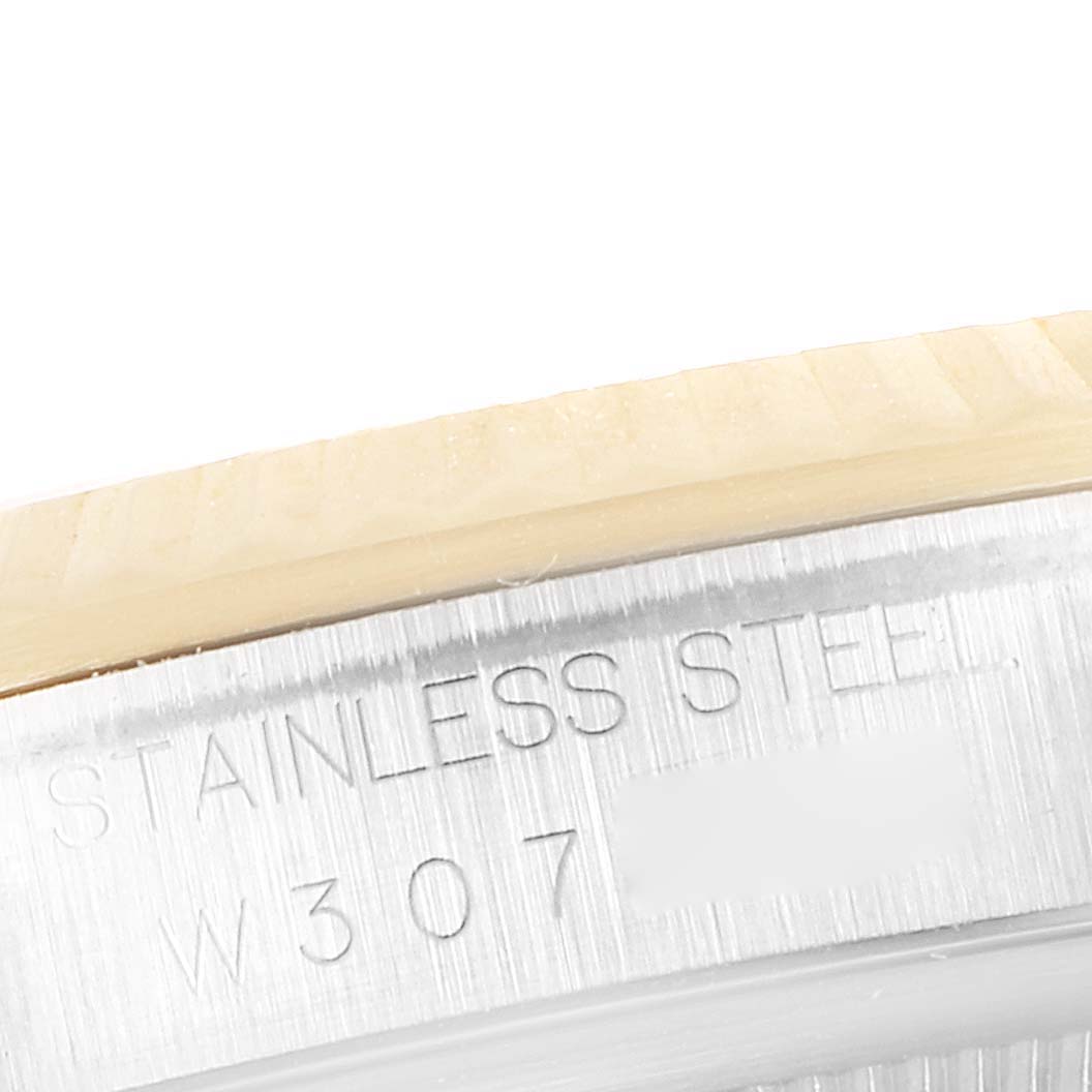 The image shows a close-up angle of the case side with "stainless steel" engraved on a Rolex Datejust 16233 Men's Steel and Gold (two tone) Champagne Dial 16233 Men's Steel and Gold (two tone) Champagne Dial watch.