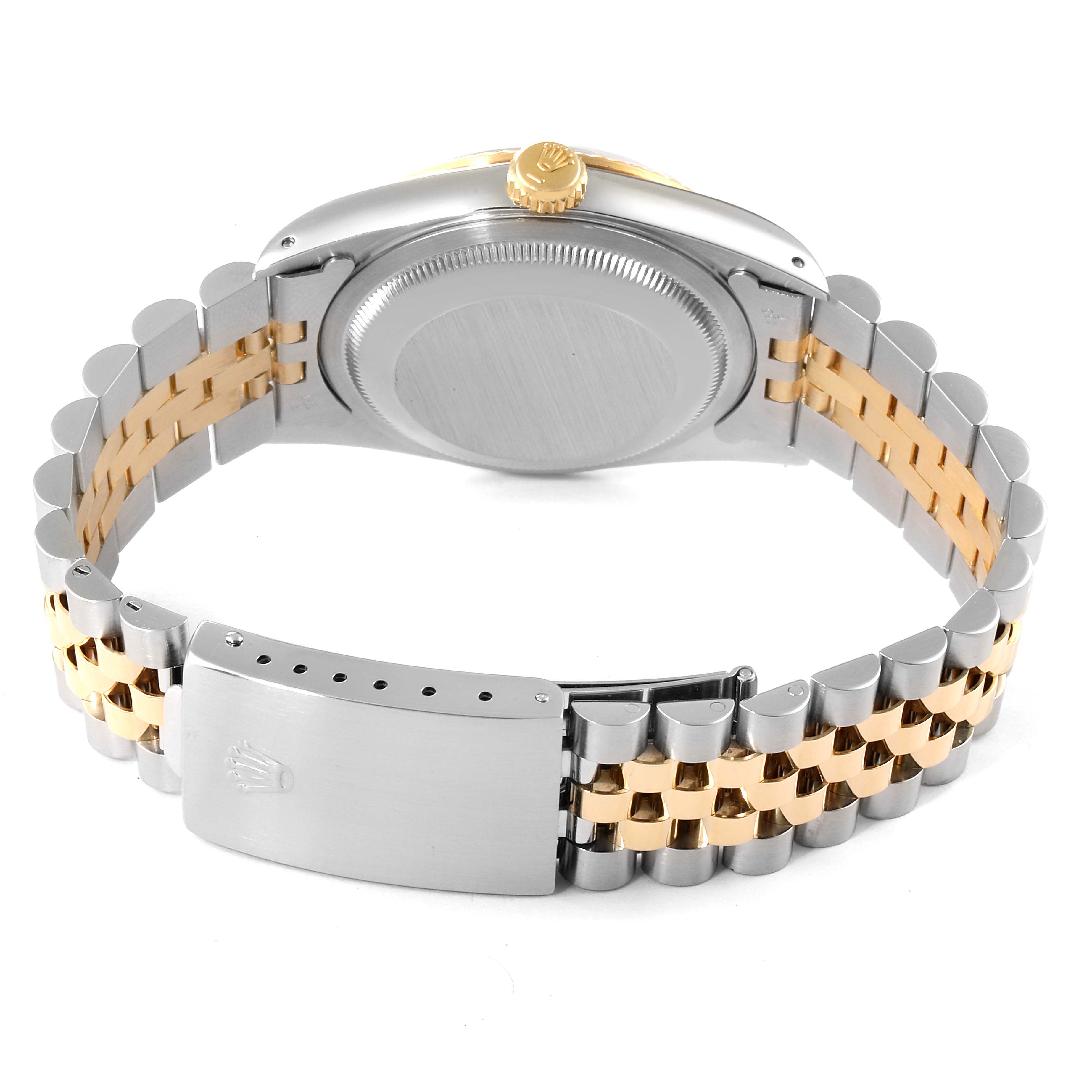 The image shows the back and bracelet of a Rolex Datejust 16233 Men's Steel and Gold (two tone) Black Dial 16233 Men's Steel and Gold (two tone) Black Dial watch in a blend of silver and gold.