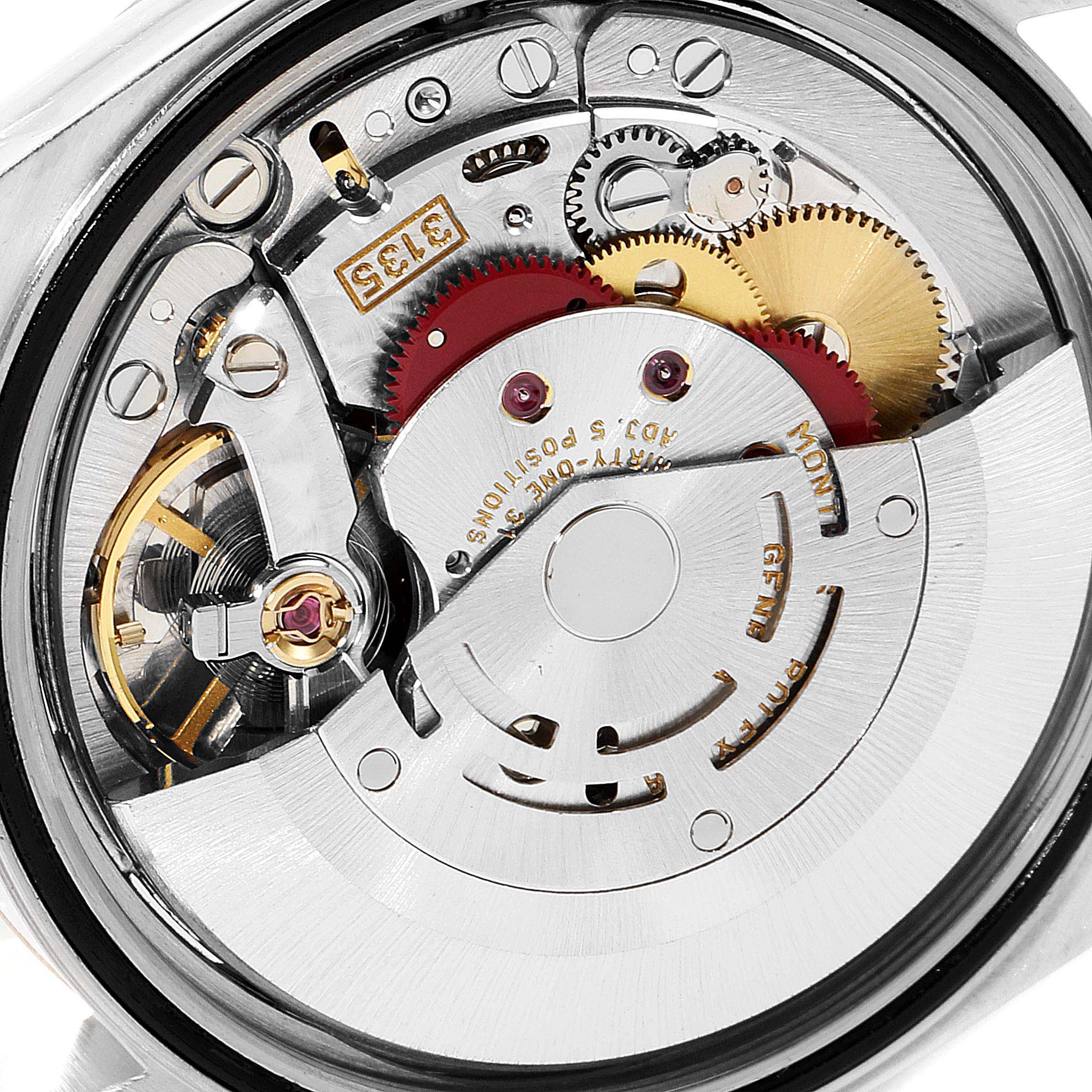 This image shows a close-up of the movement and internal components of a Rolex Datejust 16233 Men's Steel and Gold (two tone) Champagne Dial 16233 Men's Steel and Gold (two tone) Champagne Dial watch.