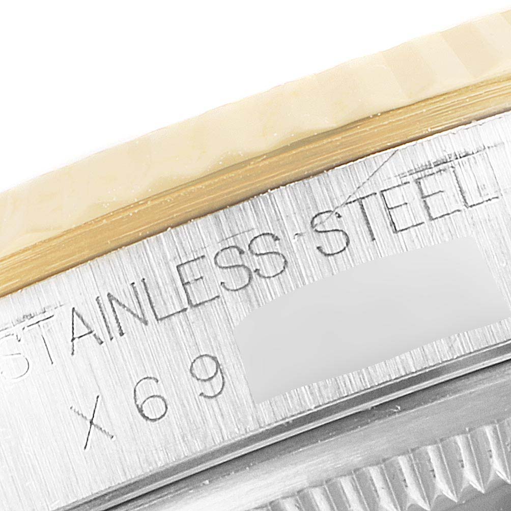 The image shows a close-up of the stainless steel case and gold fluted bezel on a Rolex Datejust 16233 Men's Steel and Gold (two tone) Champagne Dial 16233 Men's Steel and Gold (two tone) Champagne Dial watch.