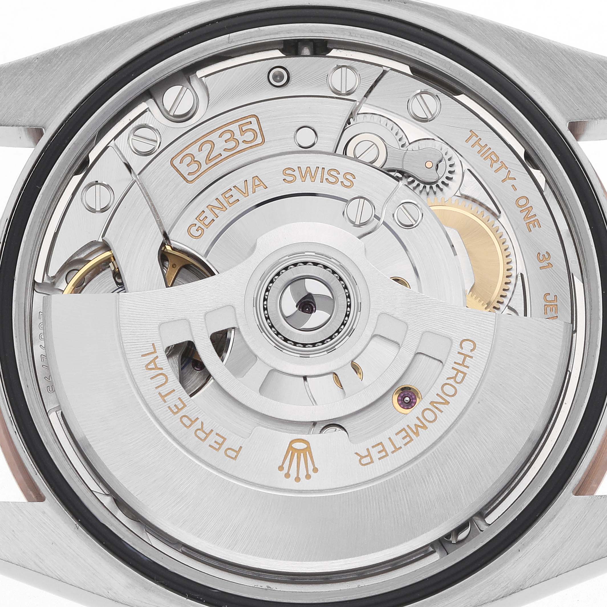 This image shows the movement mechanism of a Rolex Datejust 126231 Men's Steel and Gold (two tone) Mother of Pearl Dial watch from the back.