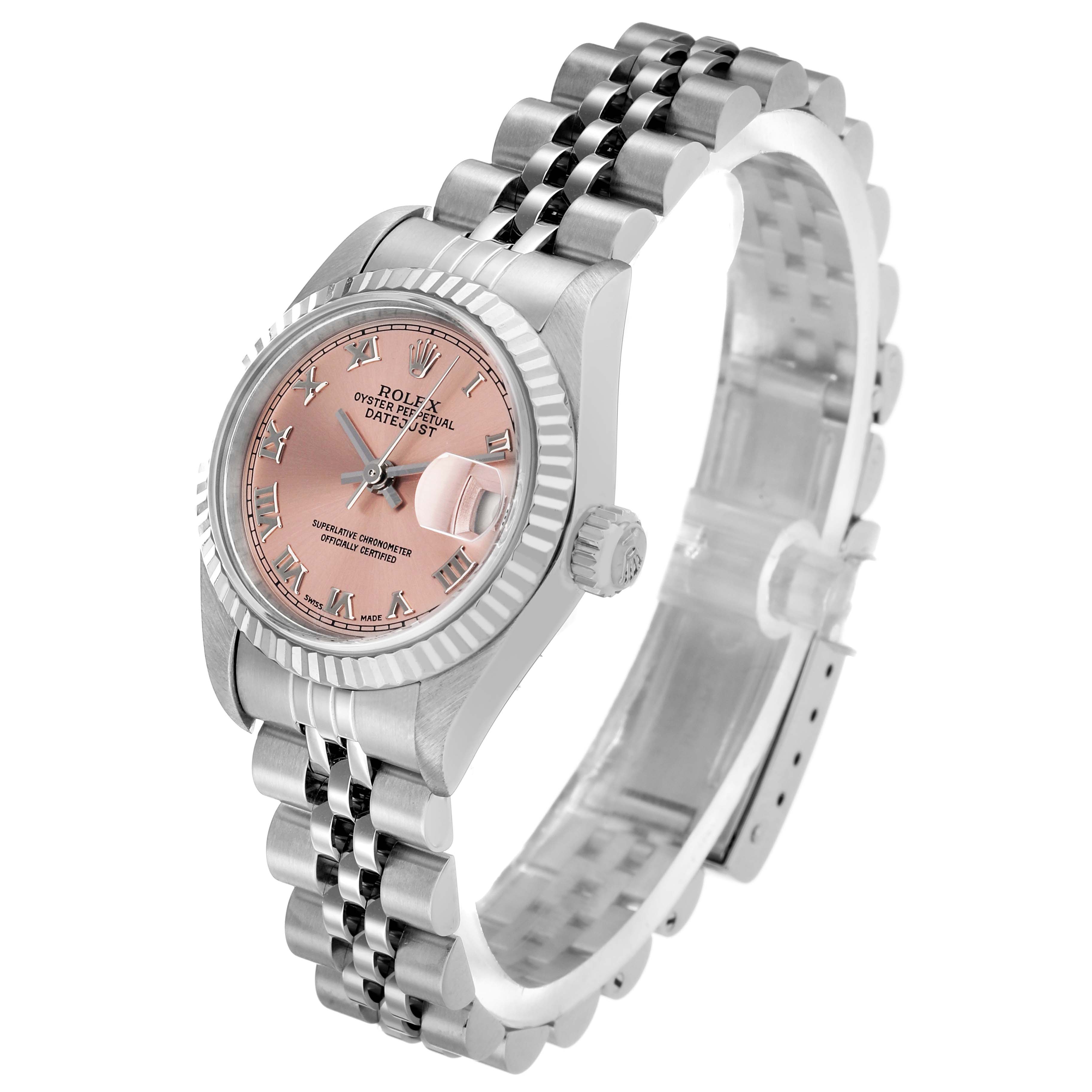 The Rolex Datejust 79174 Women's Stainless Steel Pink Dial watch is shown at an angle showcasing its face, bezel, crown, and bracelet.