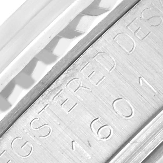 The image shows a close-up of the engraved side of a Vintage Collection Rolex watch case.