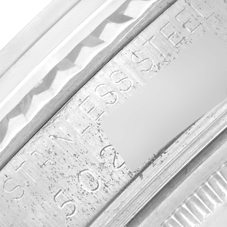 The image shows a close-up of the Rolex Vintage Collection 1601 Men's Stainless Steel Silver Dial 1601 Men's Stainless Steel Silver Dial's engraved stainless steel bezel.