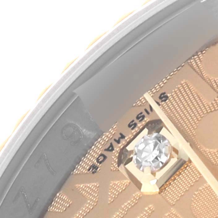 The image shows a close-up of the Rolex Datejust 116233 Men
s Steel and Gold (two tone) Champagne Dial 116233 Men
s Steel and Gold (two tone) Champagne Dial watch dial, highlighting a diamond hour marker.