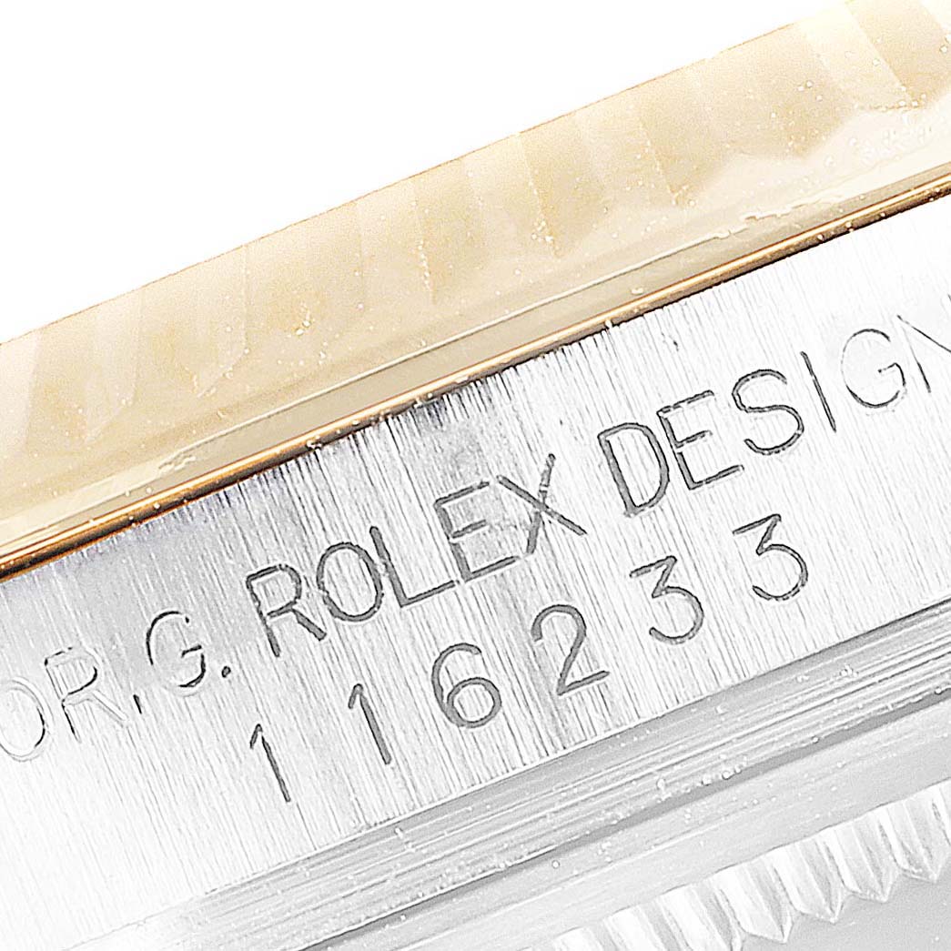 This image shows a close-up of the model and reference number on the side of a Rolex Datejust 116233 Men's Steel and Gold (two tone) Black Dial 116233 Men's Steel and Gold (two tone) Black Dial watch.