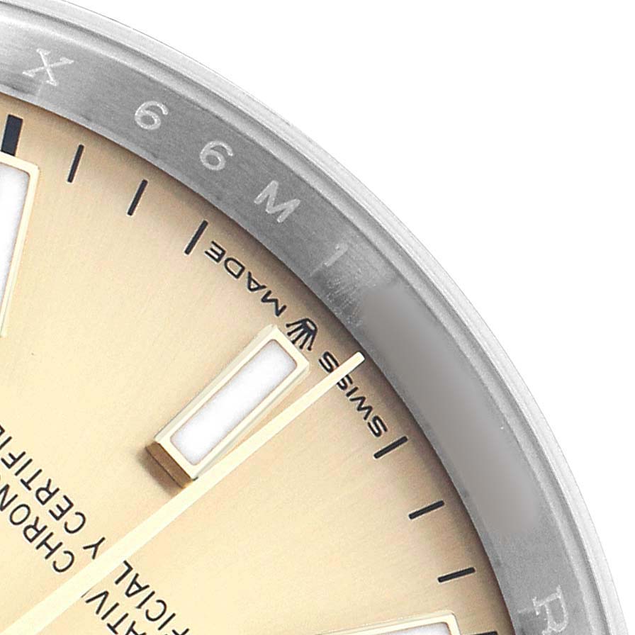 The image shows a close-up of the dial's periphery and markers, along with the bezel of the Rolex Datejust 126203 Men's Stainless Steel Champagne Dial.