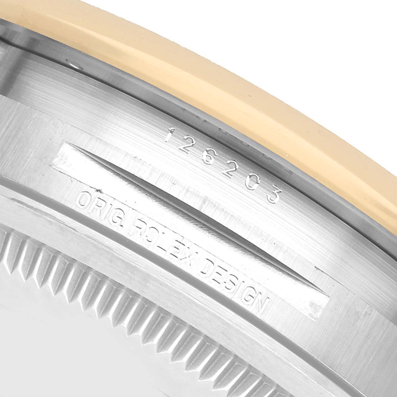 The image shows the case side of a Rolex Datejust 126203 Men's Stainless Steel Champagne Dial, highlighting the bezel and engraved model number.