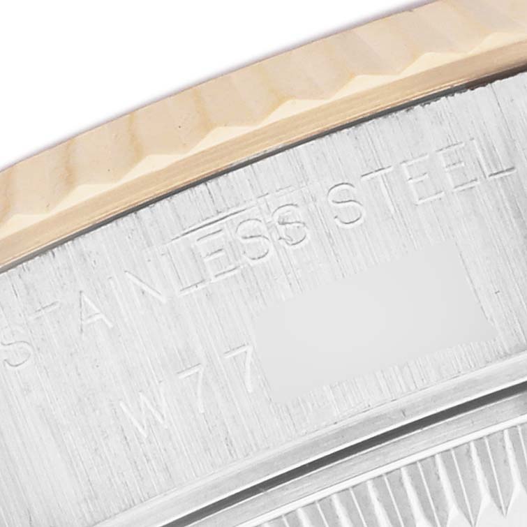 The image shows a close-up of the engraved back casing of a Rolex Datejust 69173 Women's Steel and Gold (two tone) Champagne Dial watch.