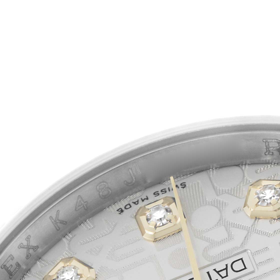 The image shows a close-up of a Rolex Datejust 116233 Men's Steel and Gold (two tone) Silver Dial dial, highlighting diamond hour markers and part of the bezel with engravings.