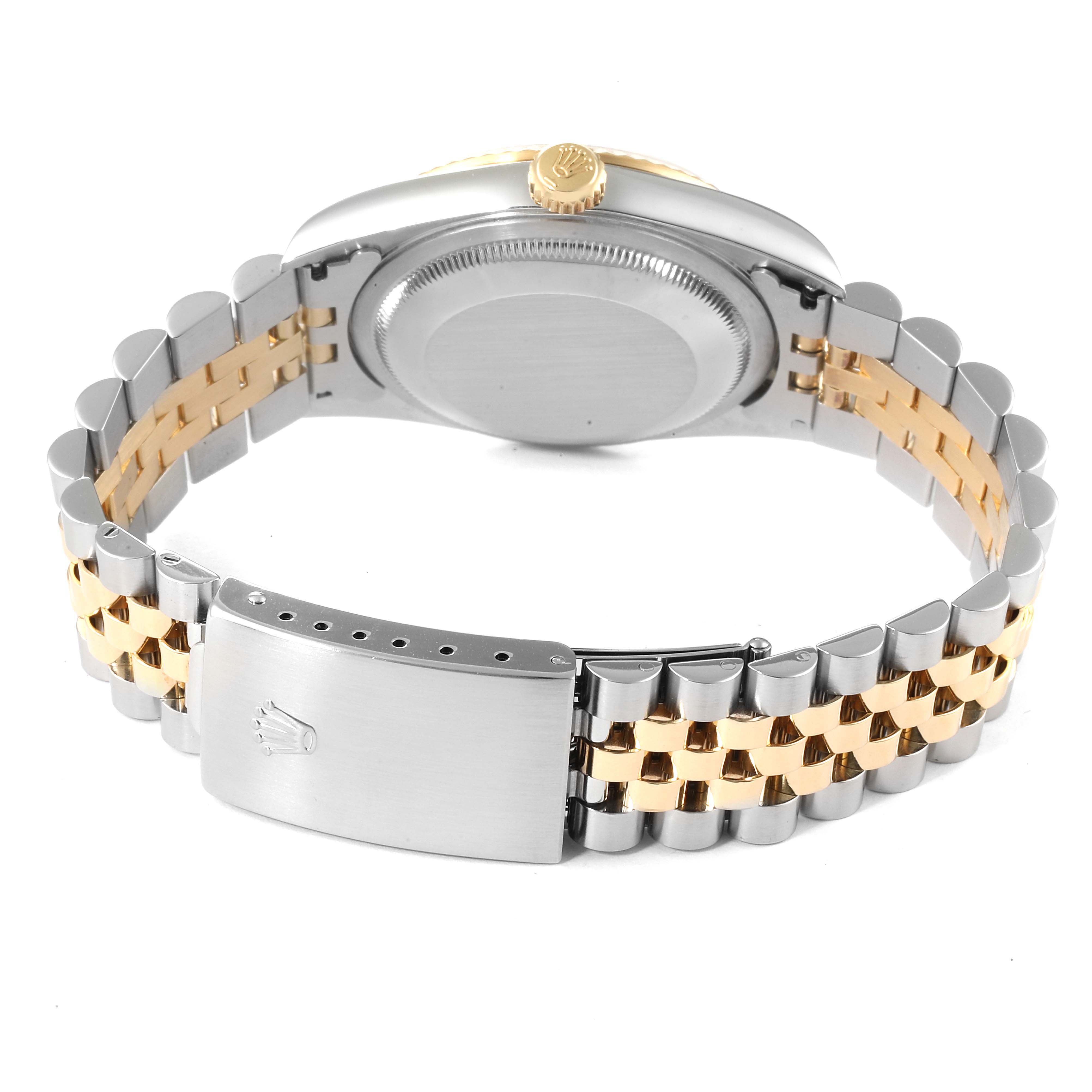 The image shows the back view of a Rolex Datejust 16233 Men
s Steel and Gold (two tone) Beige Dial 16233 Men
s Steel and Gold (two tone) Beige Dial watch, focusing on the gold and silver bracelet and the clasp.