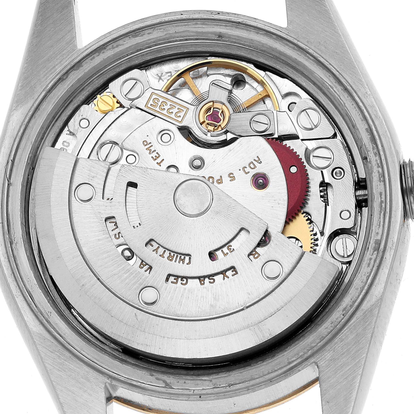 The image shows the movement of a Rolex Datejust 79163 Women's Steel and Gold (two tone) Silver Dial watch from a back angle, revealing the rotor, gears, and intricate components.