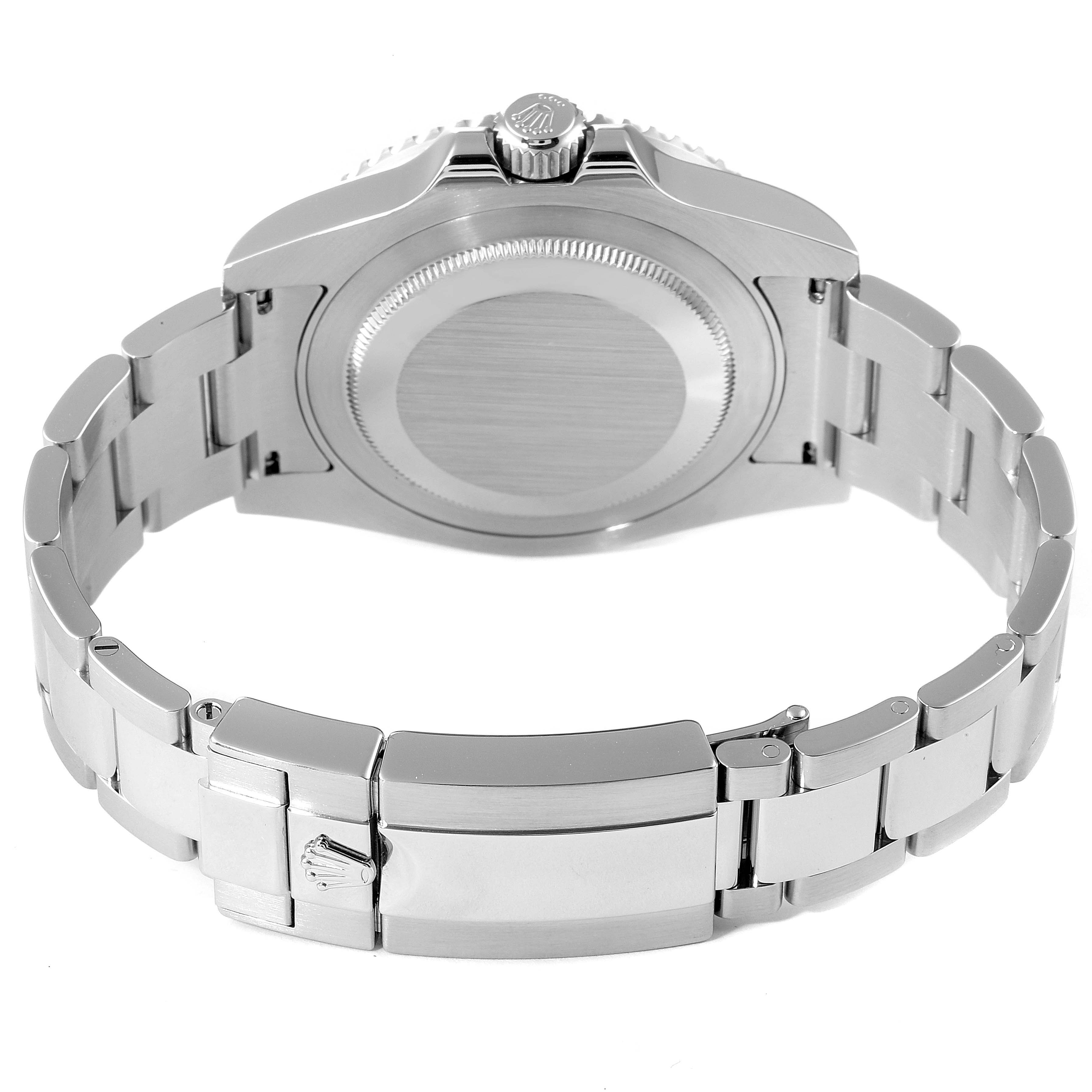 This image shows the underside of a Rolex GMT-Master 116710 Men
s Stainless Steel Black Dial 116710 Men
s Stainless Steel Black Dial watch, highlighting the case back, crown, and the metal bracelet with the clasp.