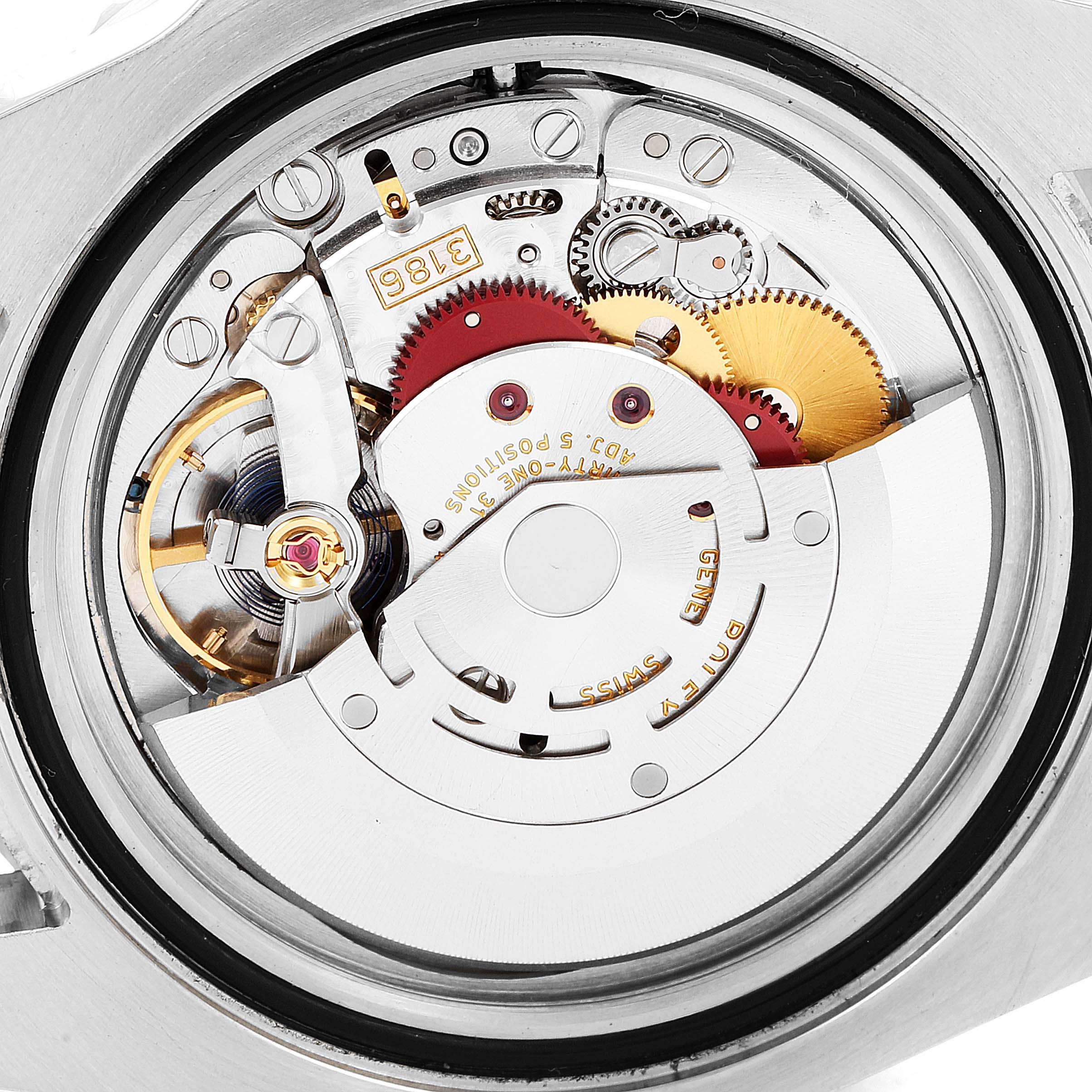 This image shows a close-up view of the movement mechanism inside a Rolex GMT-Master 116710 Men
s Stainless Steel Black Dial 116710 Men
s Stainless Steel Black Dial watch.