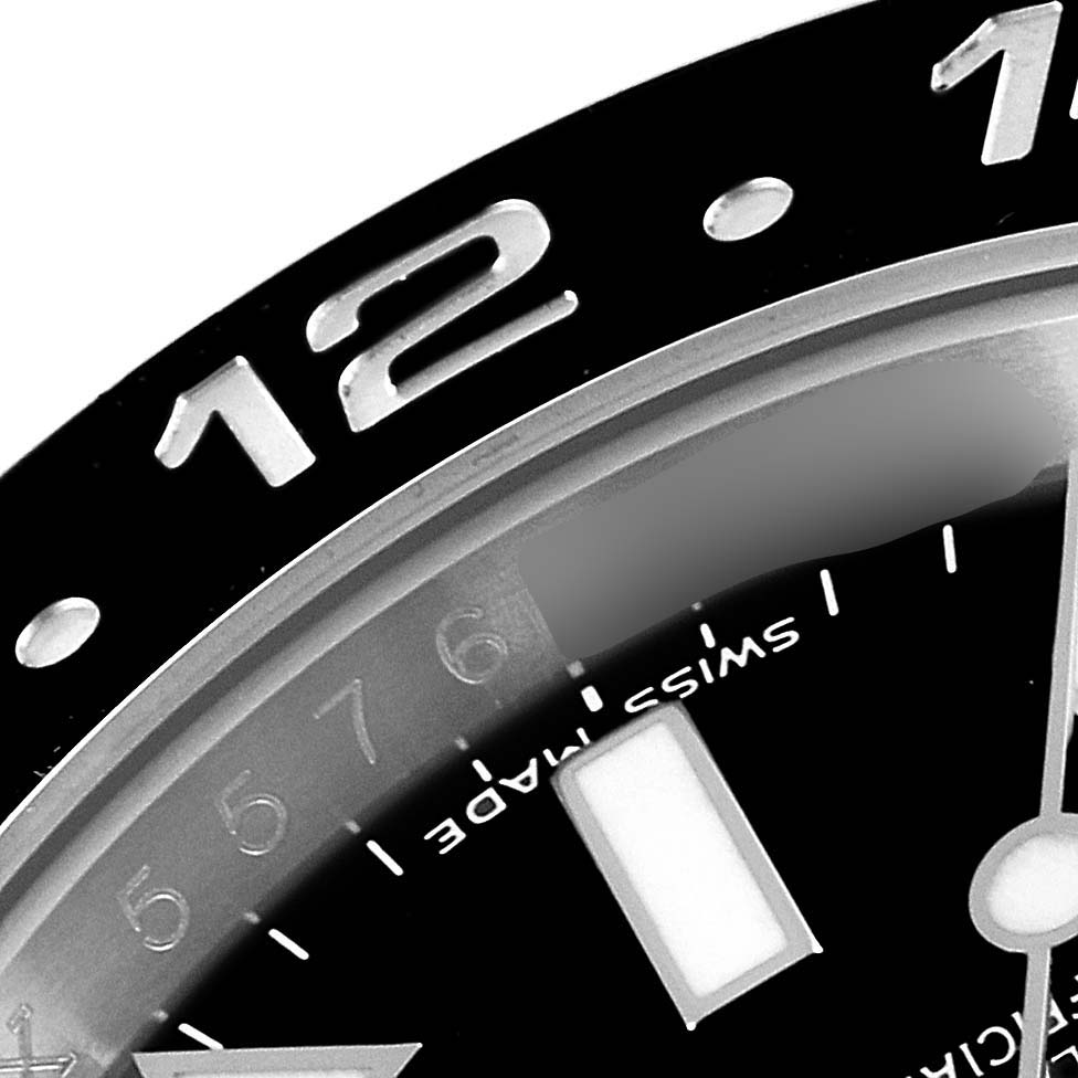 This image shows a close-up of the bezel, dial markings, and part of the hour hand of a Rolex GMT-Master 116710 Men
s Stainless Steel Black Dial 116710 Men
s Stainless Steel Black Dial watch.